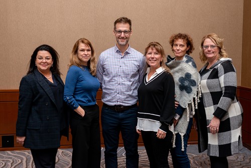 Six CISSS de l’Outaouais team members standing together for a group photo.